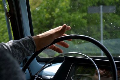 Close-up of man sitting in car