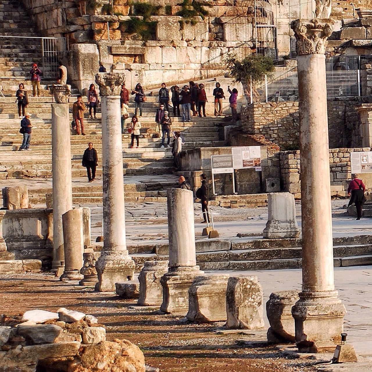 architecture, built structure, building exterior, large group of people, history, ancient, old ruin, tourism, famous place, person, architectural column, men, ancient civilization, travel destinations, tourist, the past, travel, international landmark, lifestyles