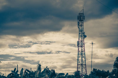 Low angle view of communications tower against sky