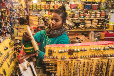 Portrait of boy looking at store