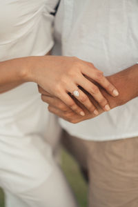 Engagement shoot of couple holding hands