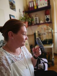 Woman with bird at home