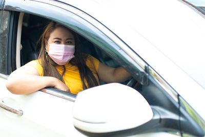 Portrait of girl in car