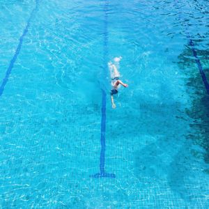 High angle view of people swimming in water