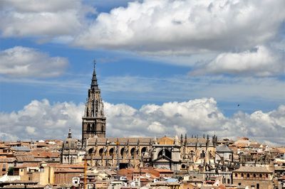 Buildings in city against sky