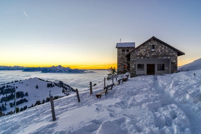 Scenic view of snow covered landscape against sky