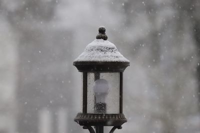 Close-up of wet snow covered house during winter