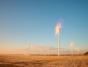 Windmills for renewable electric energy production. vintage style toned effect