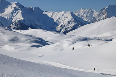 Alpine landscape in winter at alpe d'huez with the mountains covered in snow