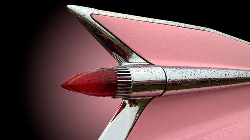 Close-up of water drops on metal against gray background