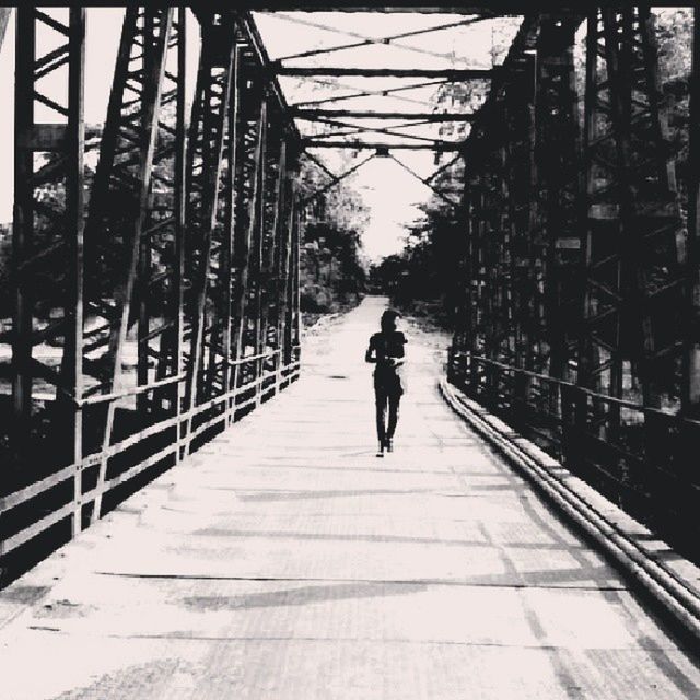 full length, the way forward, walking, rear view, lifestyles, transportation, diminishing perspective, men, built structure, architecture, vanishing point, leisure activity, tree, street, city, person, on the move, bicycle