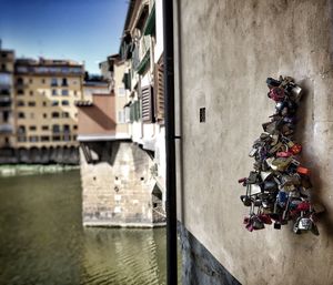 Love locks hanging on building over canal
