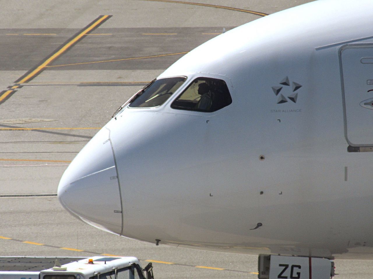 transportation, airplane, mode of transport, airport runway, no people, air vehicle, day, outdoors, aerospace industry, close-up, passenger boarding bridge