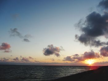 Scenic view of sea against sky at sunset