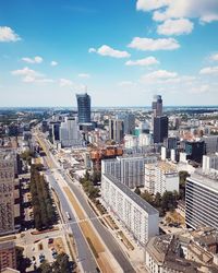 High angle view of street amidst buildings in city against sky