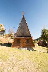 Built structure on field against clear sky