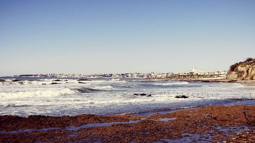 Scenic view of sea against clear sky