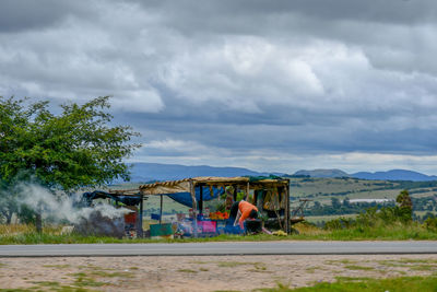 Built structure on road by buildings against sky