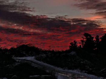 Scenic view of dramatic sky during sunset