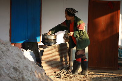 Woman preparing food in room