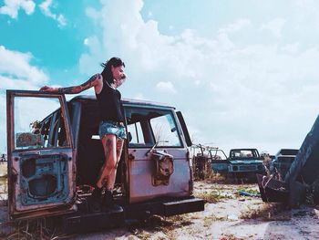 Rebel young woman posing outdoors