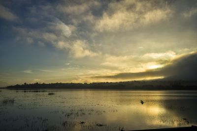View of lake against cloudy sky