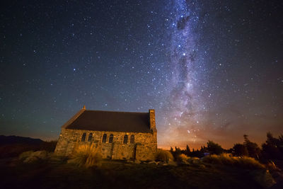 Panoramic view of historic building against sky at night