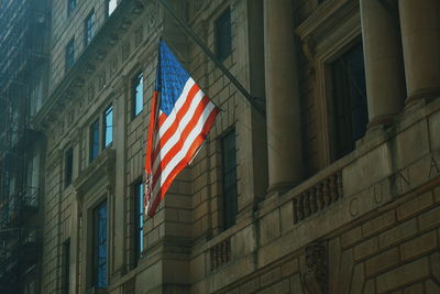 Low angle view of american flag on building