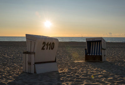 Hooded chairs on beach
