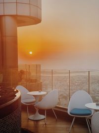 Empty chairs and tables in restaurant