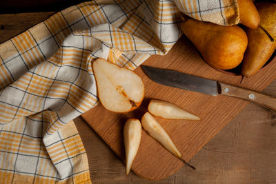 Cropped hand of person holding food on table