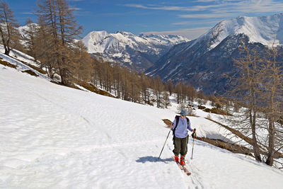 Full length of person on snowcapped mountains during winter