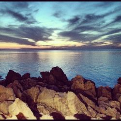 Scenic view of sea at sunset