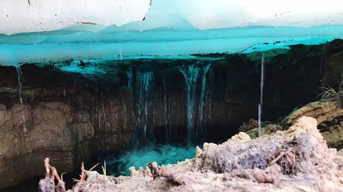 Panoramic view of icicles on rock formation during winter