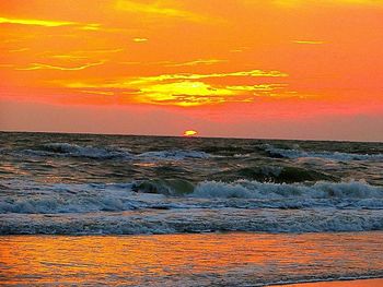 Scenic view of sea at sunset