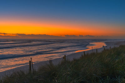 Scenic view of sea against sky during sunset