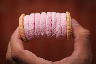 Close-up of hand holding ice cream