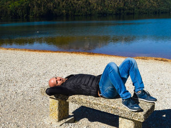 Man sleeping on lake