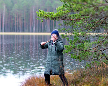 Portrait of man standing in lake