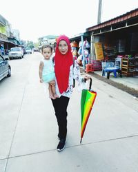 Portrait of friends on street in city