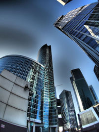 Low angle view of modern buildings against sky