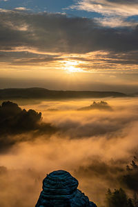 Scenic view of dramatic sky during sunset