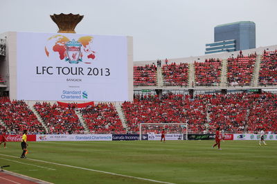 Information sign against sky