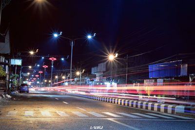 Light trails on city street at night