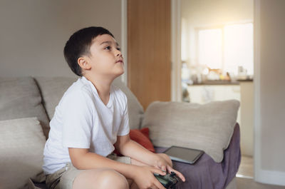 Young woman using digital tablet at home