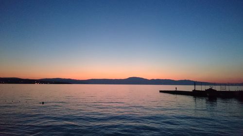 Scenic view of calm sea at sunset