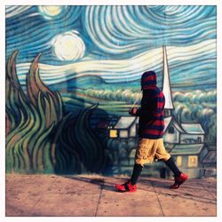 Full length of woman standing by railing