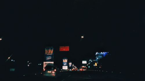 Illuminated buildings in city at night
