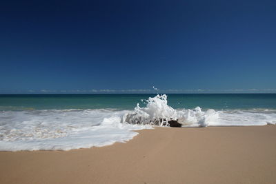 Scenic view of sea against clear sky