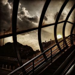 Bridge in city against sky